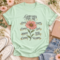 Mint T-shirt with a pink flower and “God Says You Are” affirmations: loved, chosen, worthy, capable, strong, safe, never alone, and victorious.