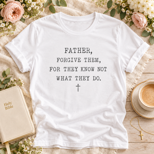 A white short-sleeve T-shirt has black printed text reading, 'FATHER, FORGIVE THEM, FOR THEY KNOW NOT WHAT THEY DO."